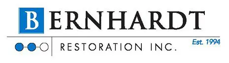 A black and white logo of the company anha restoration.