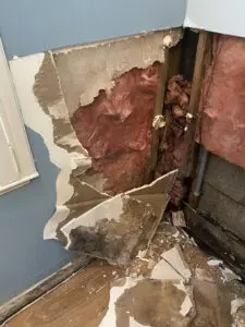 A room with the walls torn down and being remodeled.