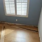 A room with wood floors and a window.