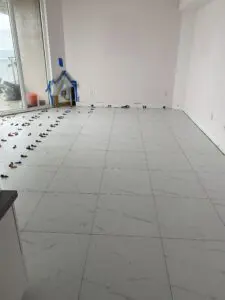 A room with tile floor and white walls.
