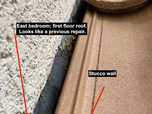 A close up of the floor and wall of a house